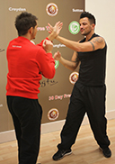 Master Paul Hawkes and Peter Andre practicing their Wing Chun during the National franchise launch at Kung Fu Schools Croydon